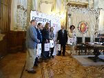 Los organizadores tras la presentación de la campaña