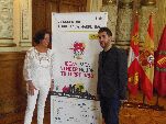 Cantalapiedra y Díaz-Caneja junto al cartel del encuentro