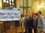 Las autoridades junto al cartel del Upstream